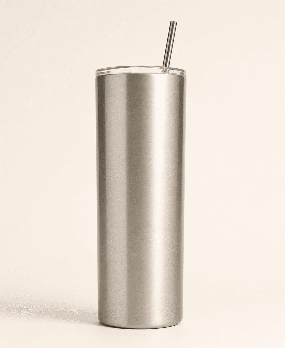 Blank neutral-toned tumbler positioning concept with a clear lid and straw.